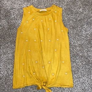 A mustard with pearls blouse